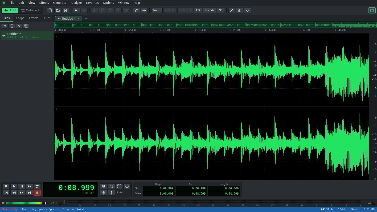 The Auditius editor recording from the microphone, with the red Record button lit in the transport bar and the input level meter moving